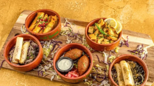 Best kebab in Leeds. Middle Eastern food platter with falafel, stuffed vine leaves, savoury wraps and grilled vegetables